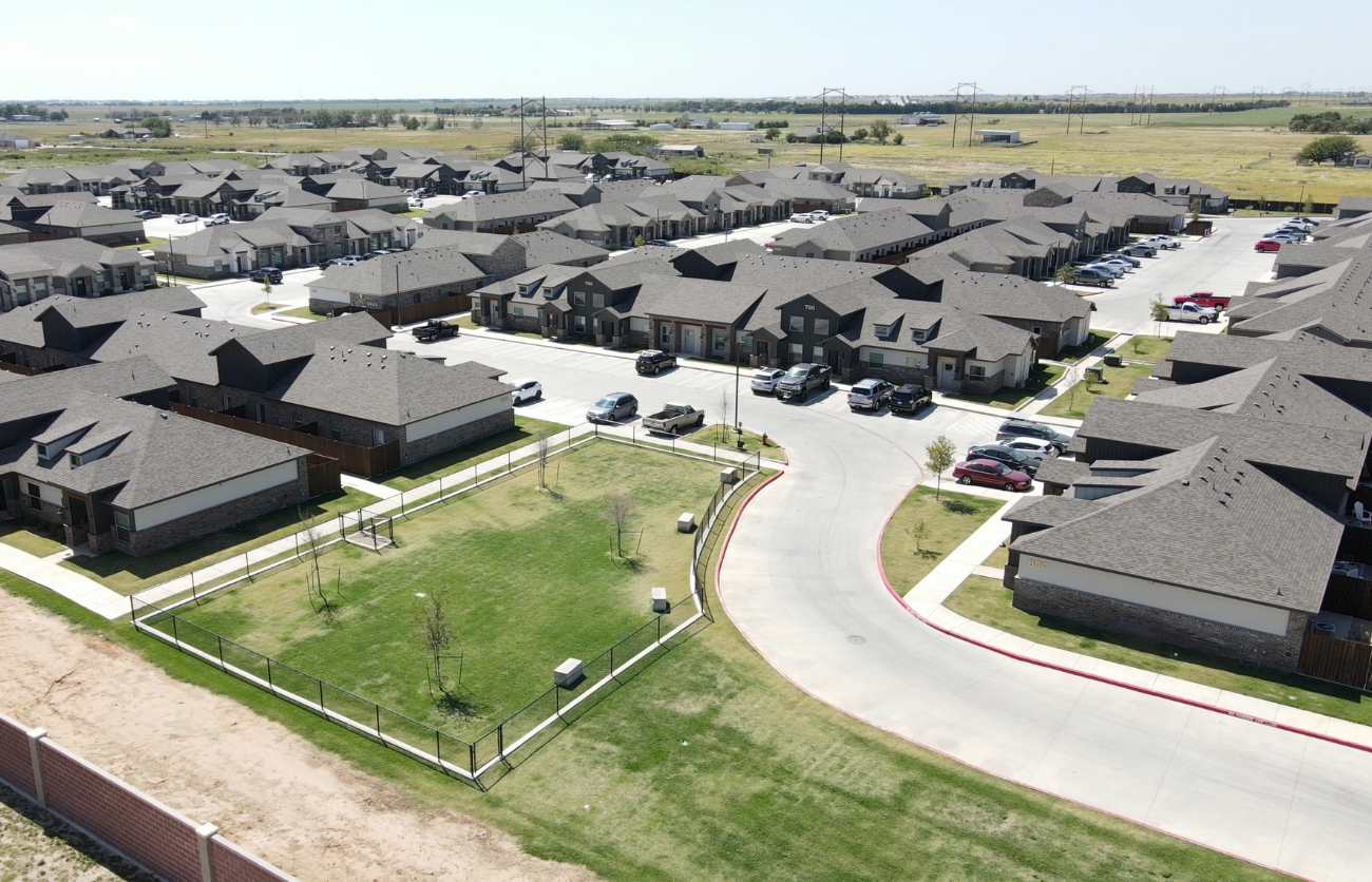 Citadel-built apartment complex community with sustainable features and luxury amenities, like a dog park, in West Texas.
