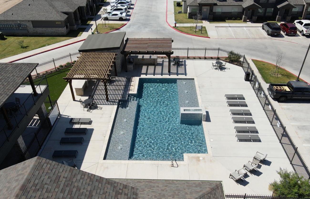 Modern apartment complex built by Citadel Construction in Lubbock, Texas with beautiful community pool.
