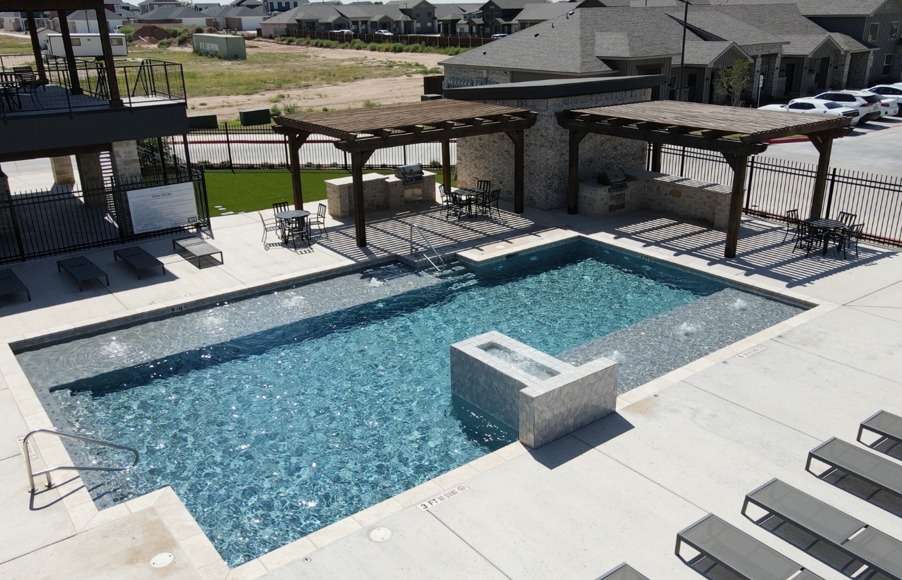 Resort-style swimming pool designed and constructed by Citadel Construction.