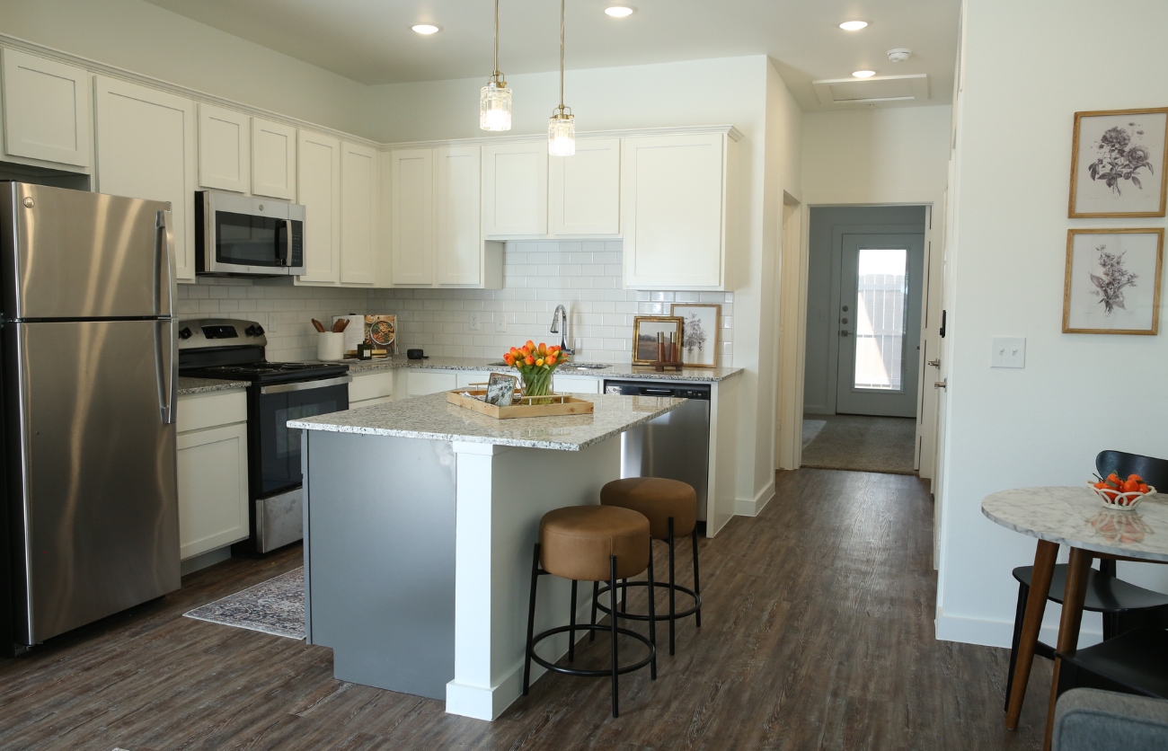 Stylish apartment living space built by Citadel Construction featuring premium flooring and fixtures.