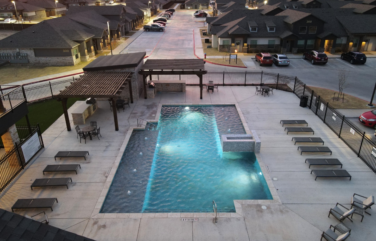 Resort-style swimming pool at The Leighton Apartments built by Citadel Construction.